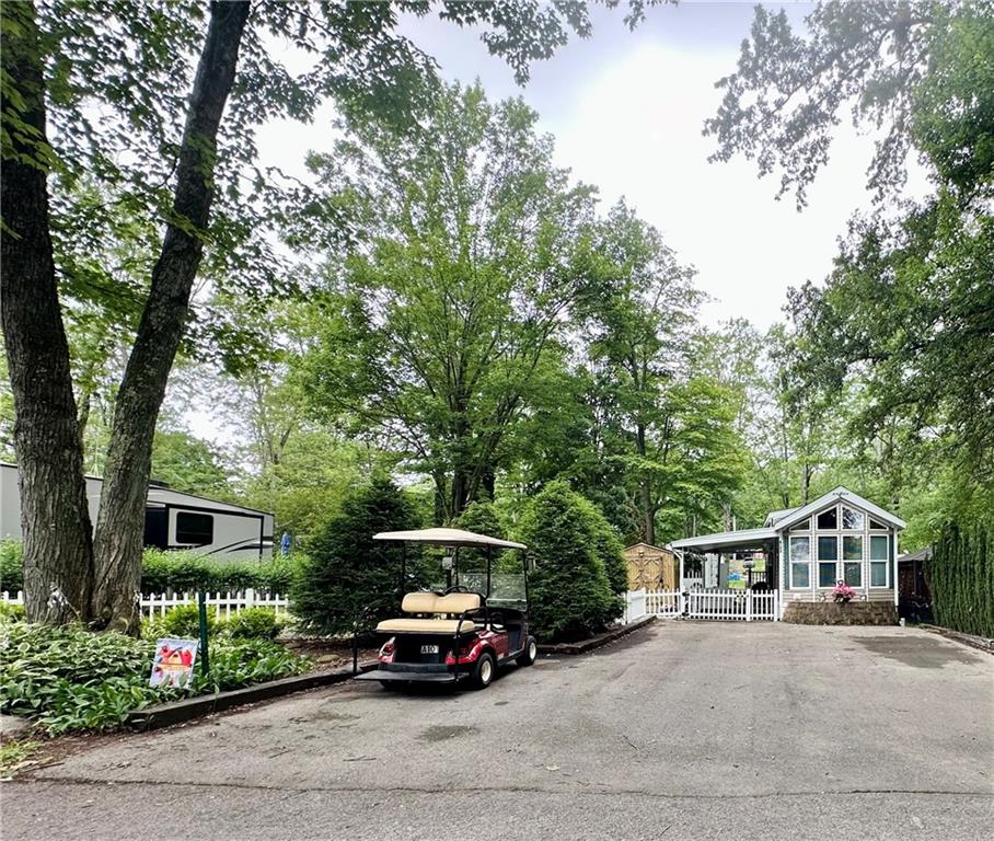 1150 West Park Road Slippery Rock, PA 16057 - Photo 1 of 22 a front view of a house with a garden and trees
