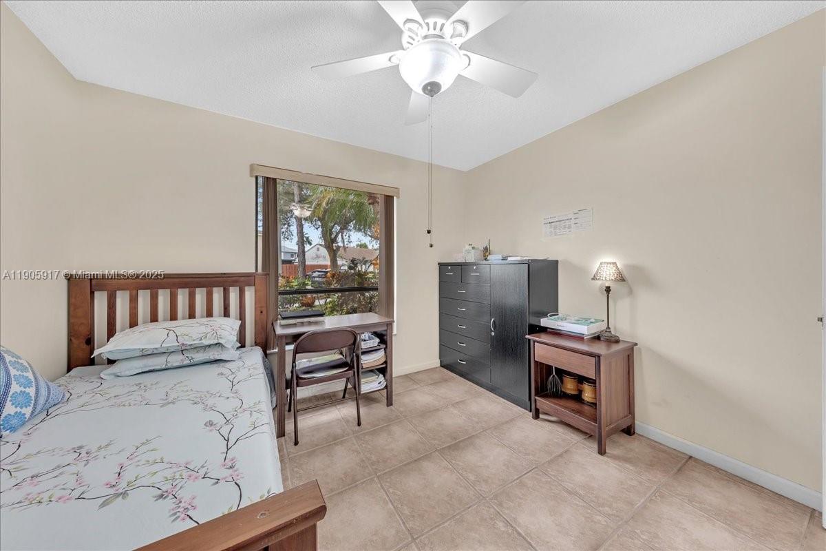 3930 Northwest 79th Way Davie, FL 33024 - Photo 19 of 33 a bedroom with furniture and a window