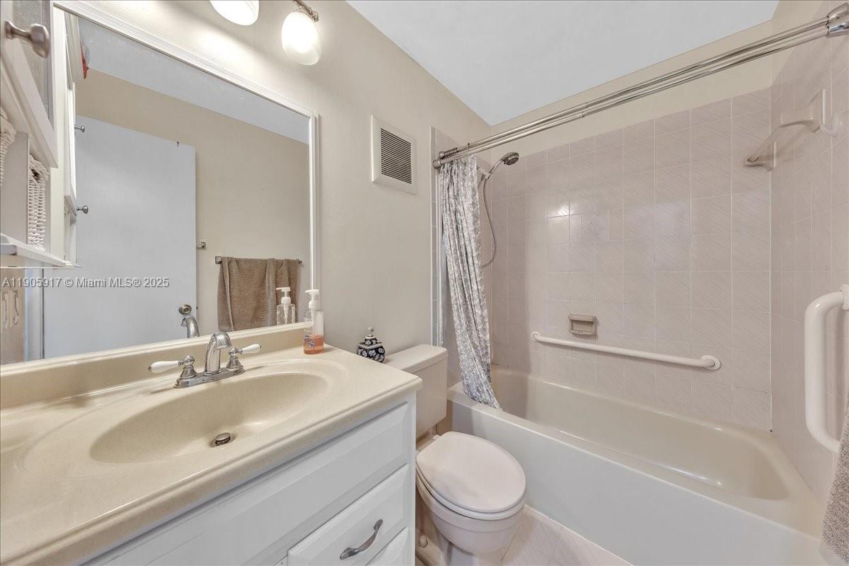 3930 Northwest 79th Way Davie, FL 33024 - Photo 21 of 33 a bathroom with a sink toilet a mirror and shower