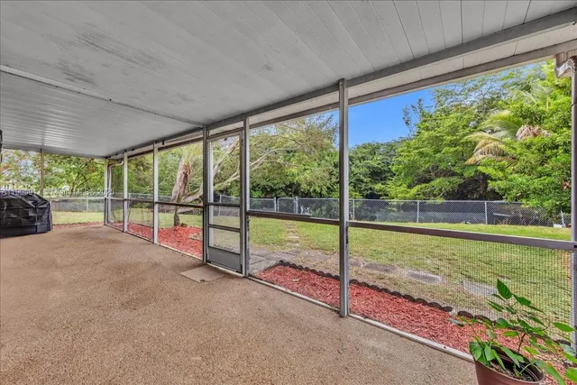 a view of a garden and deck