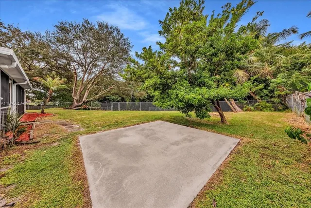 a view of a park with large trees