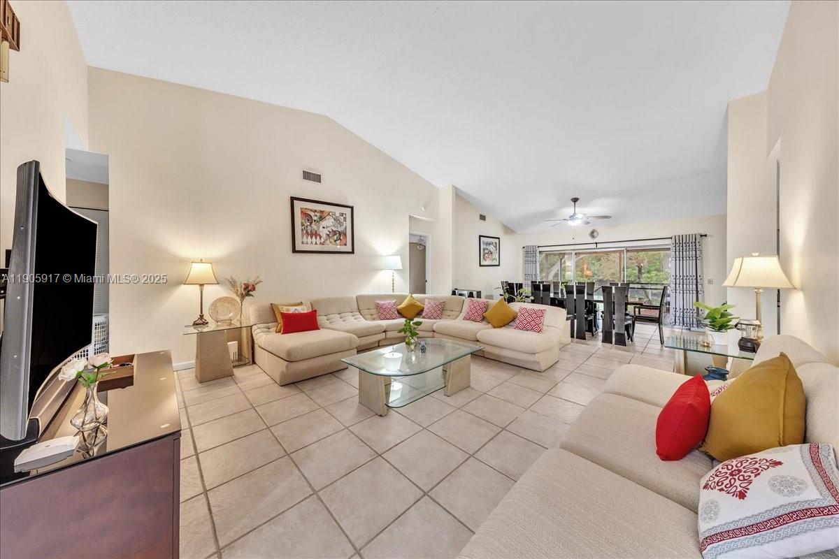 3930 Northwest 79th Way Davie, FL 33024 - Photo 3 of 33 a living room with furniture and a flat screen tv
