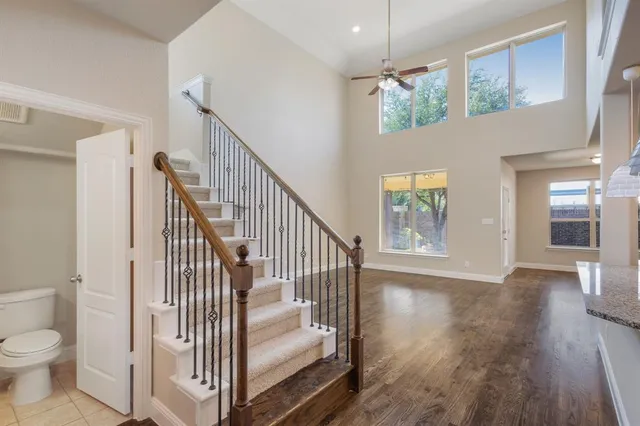 a view of entryway and hall with wooden floor
