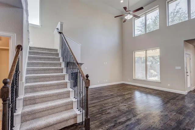 a view of an entryway with wooden floor and door
