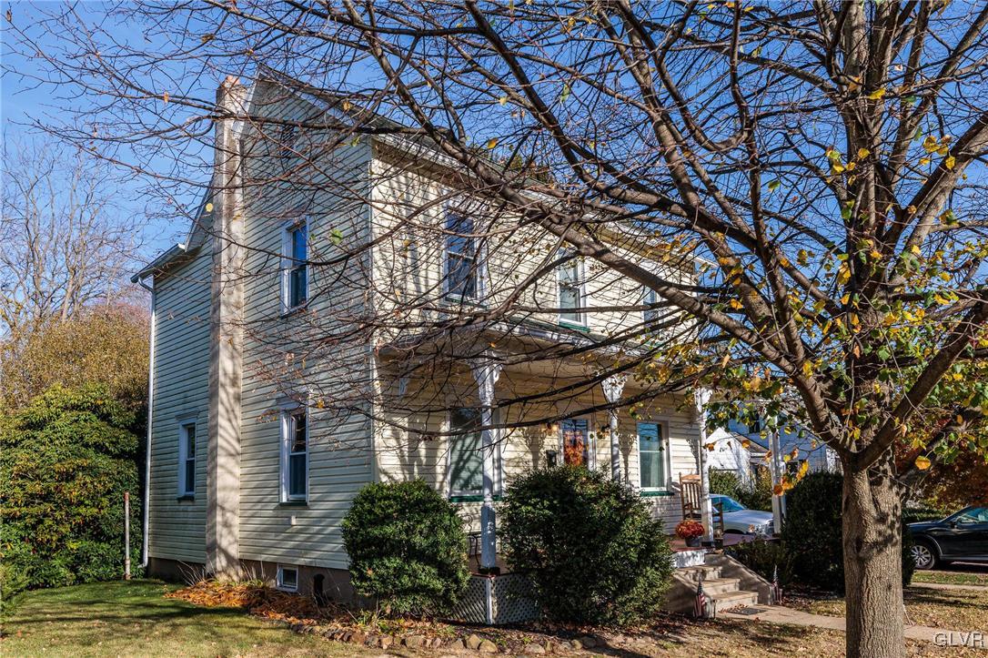 615 Alpha Road Wind Gap, PA 18091 - Photo 1 of 38 a yellow house with trees in front of it
