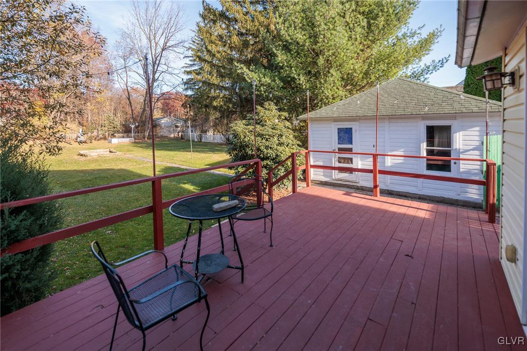 615 Alpha Road Wind Gap, PA 18091 - Photo 11 of 38 a view of a chairs and table on the wooden floor