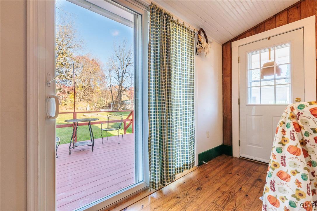 615 Alpha Road Wind Gap, PA 18091 - Photo 14 of 38 a view of a bedroom with wooden floor and a bed