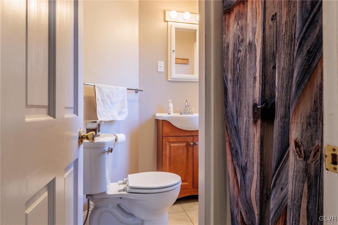 615 Alpha Road Wind Gap, PA 18091 - Photo 15 of 38 a white toilet sitting next to a bathroom sink
