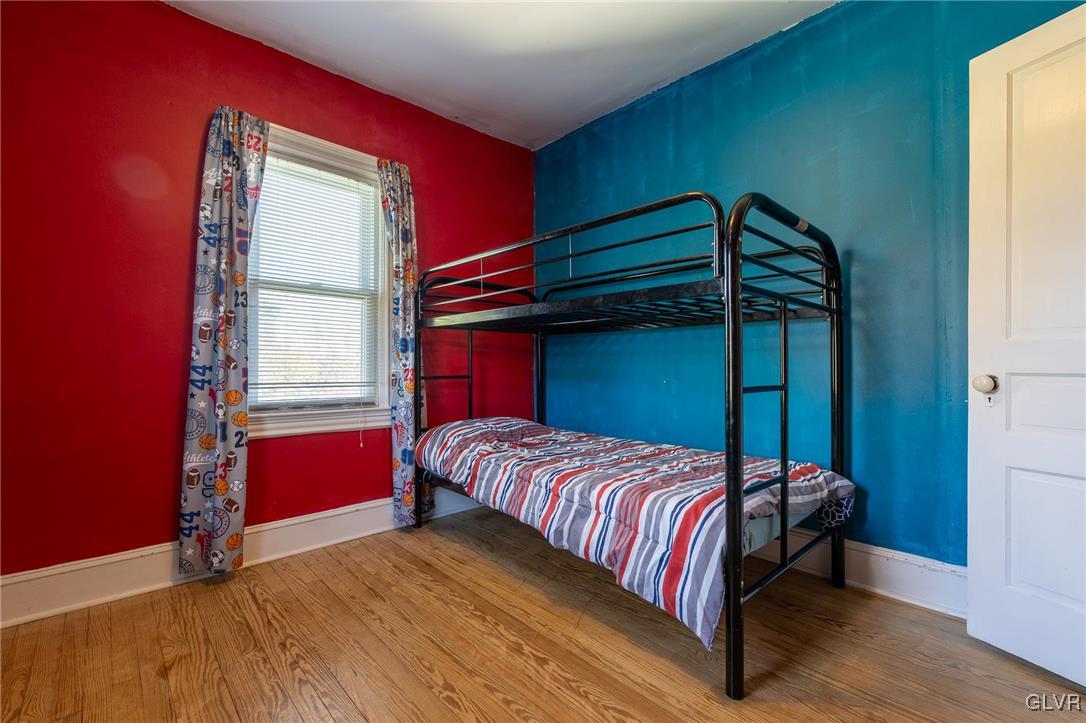 615 Alpha Road Wind Gap, PA 18091 - Photo 24 of 38 a bedroom with a bed and a window