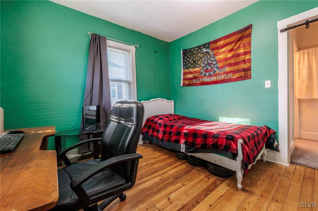 615 Alpha Road Wind Gap, PA 18091 - Photo 25 of 38 a bed sitting in a bedroom next to a window