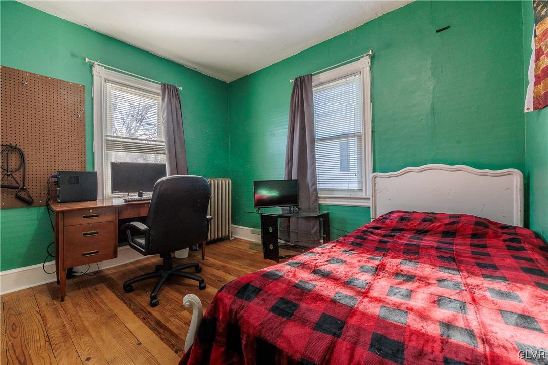 615 Alpha Road Wind Gap, PA 18091 - Photo 26 of 38 a bedroom with a bed and windows