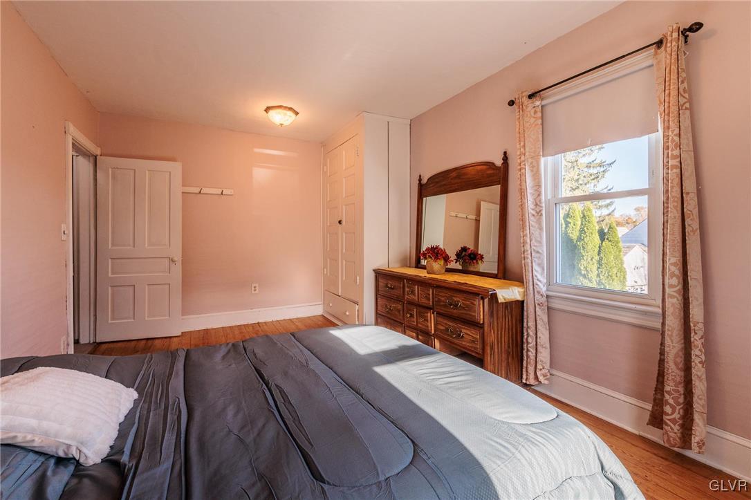 615 Alpha Road Wind Gap, PA 18091 - Photo 29 of 38 a bedroom with a bed and a mirror