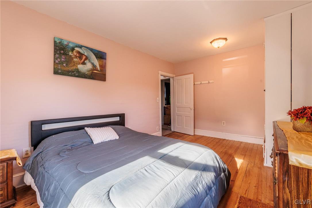 615 Alpha Road Wind Gap, PA 18091 - Photo 30 of 38 a bedroom with a bed and a painting on the wall