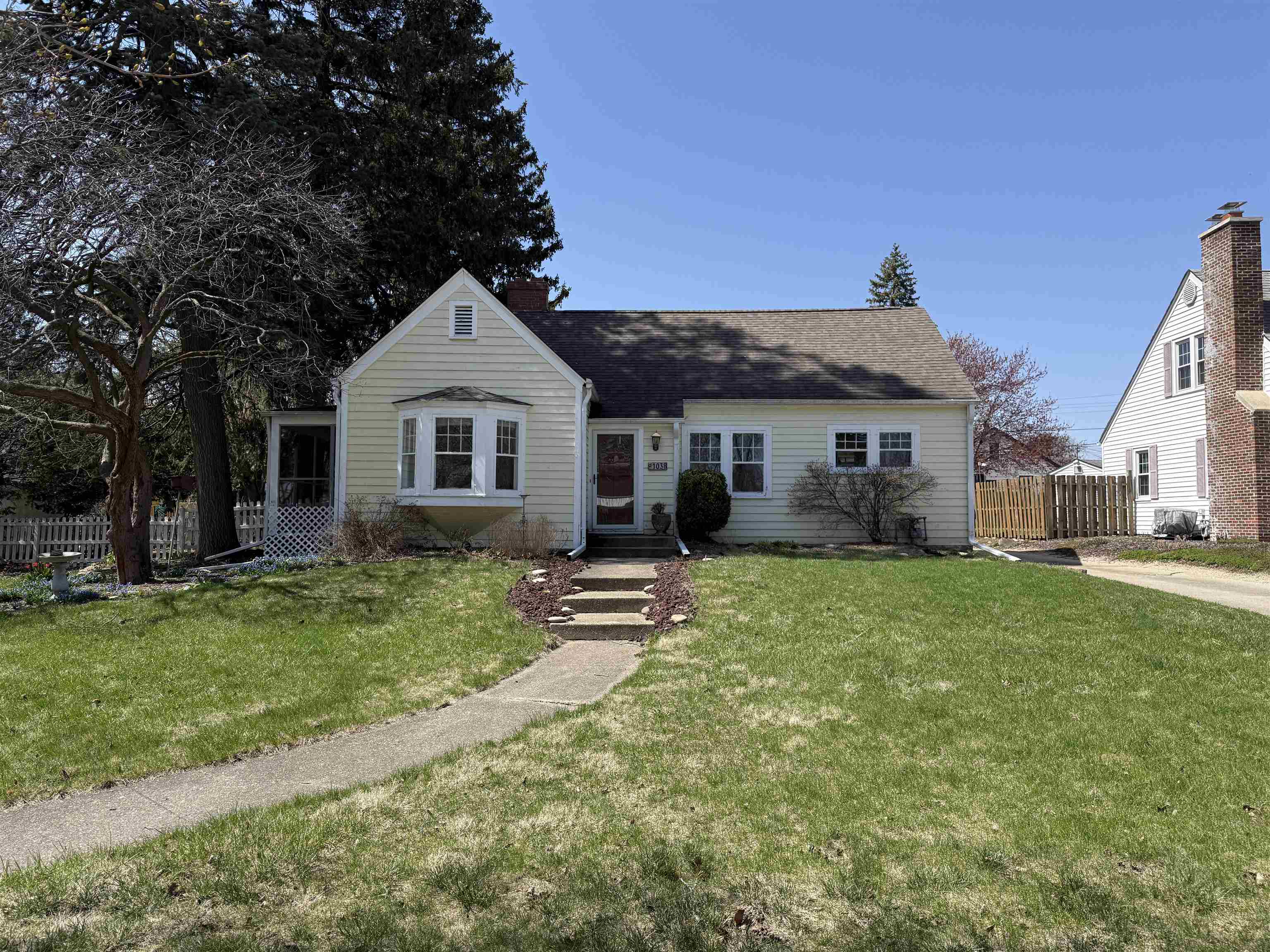 1038 North 8th Street Rochelle, IL 61068 - Photo 1 of 24 a front view of a house with a garden