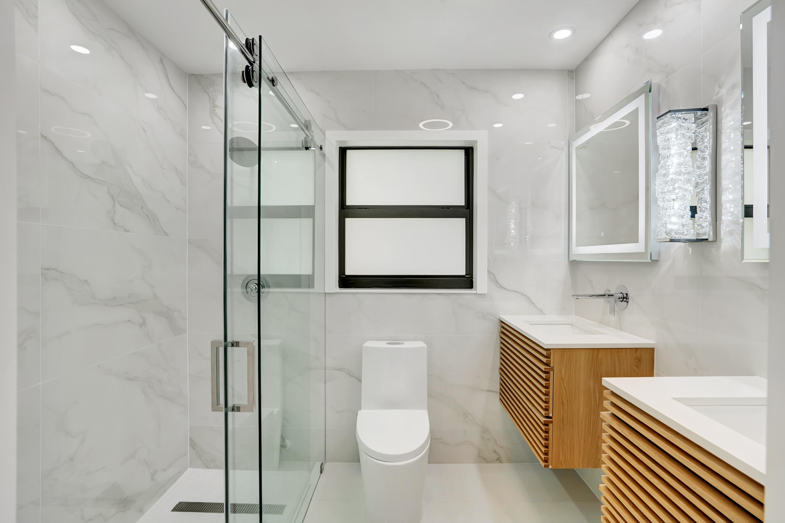 21075 Madria Circle Boca Raton, FL 33433 - Photo 11 of 29 a bathroom with a toilet sink and mirror