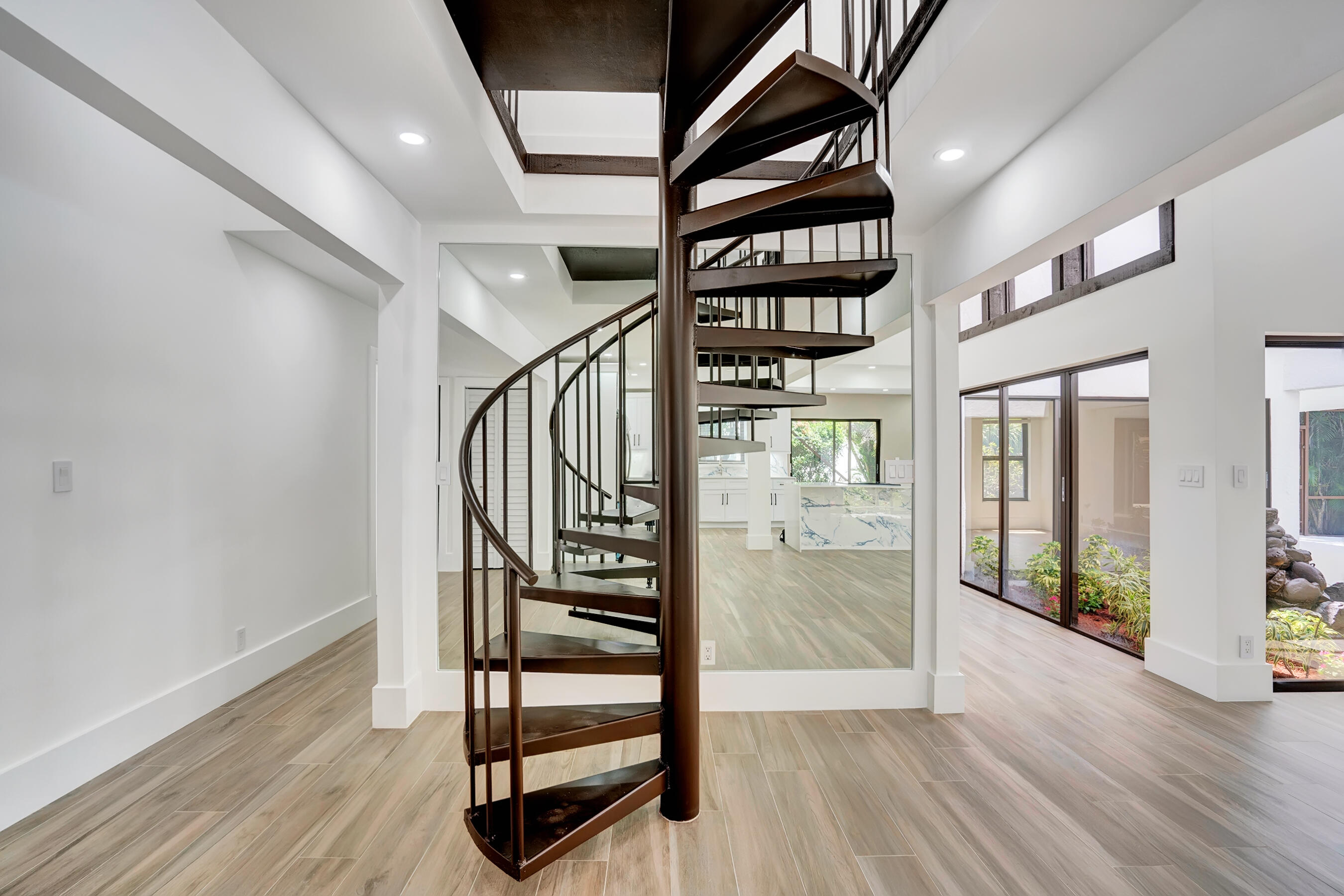 21075 Madria Circle Boca Raton, FL 33433 - Photo 14 of 29 a view of entryway with stairs and wooden floor
