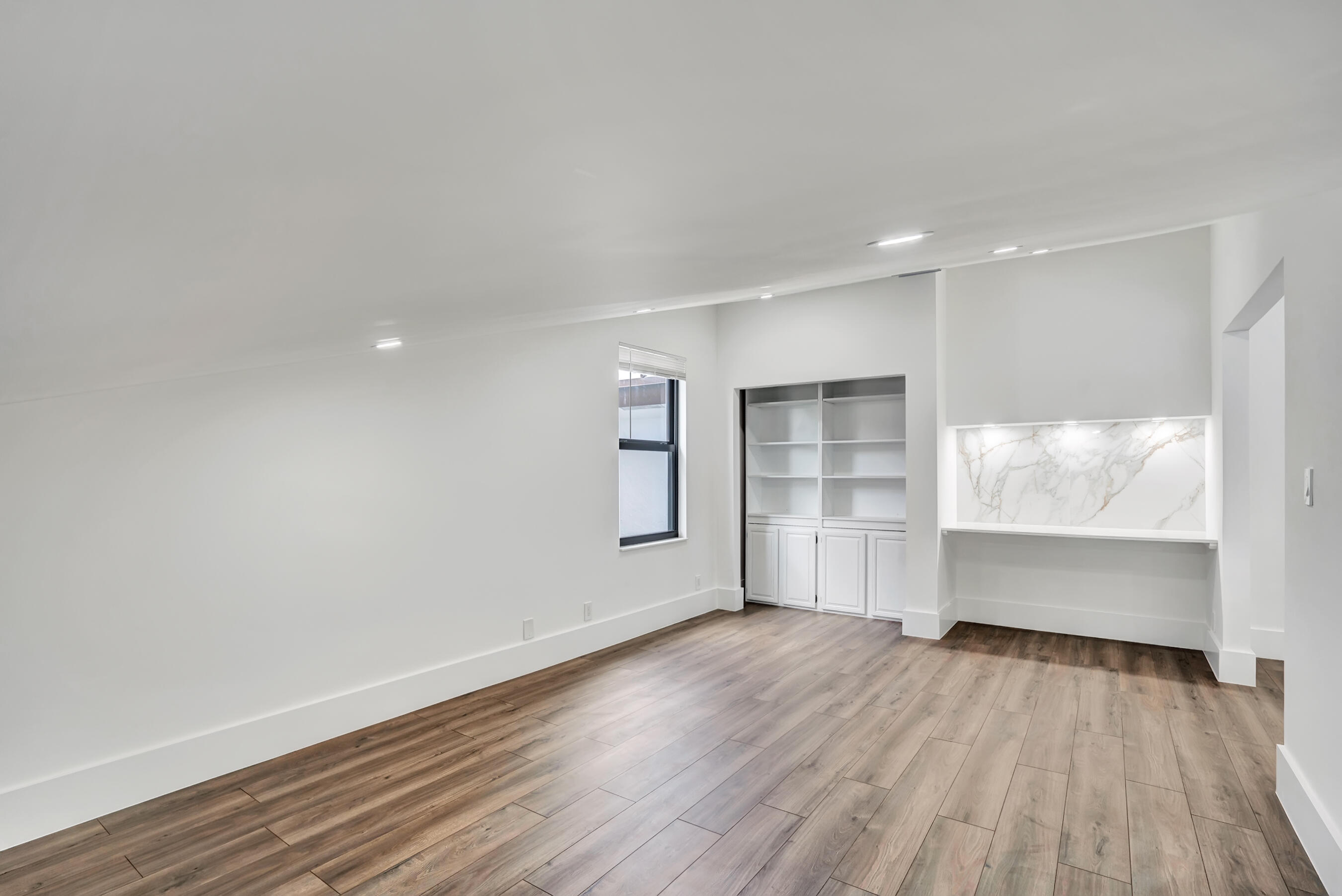21075 Madria Circle Boca Raton, FL 33433 - Photo 19 of 29 an empty room with wooden floor and windows