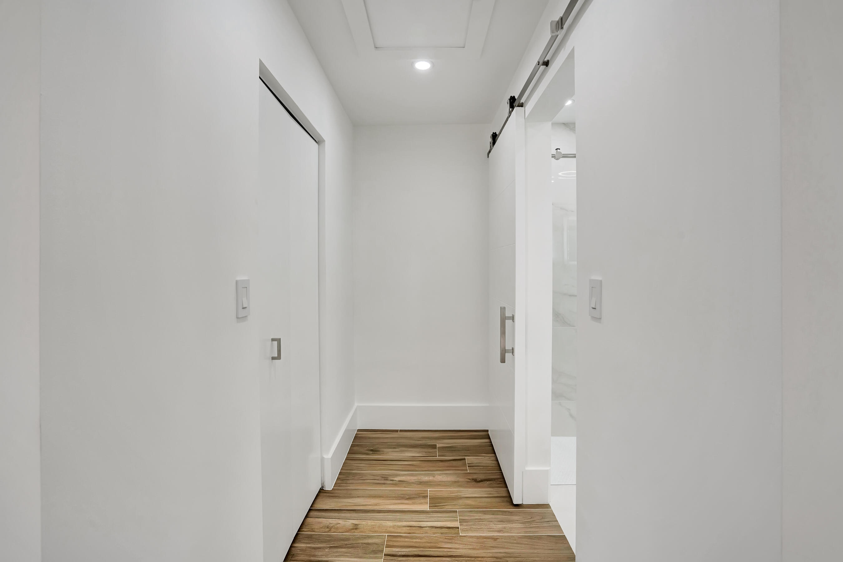 21075 Madria Circle Boca Raton, FL 33433 - Photo 8 of 29 a view of a hallway with wooden floor and staircase