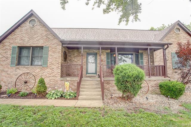 9514 State Route 143 Edwardsville, IL 62025 - Photo 1 of 29 a front view of a house with garden