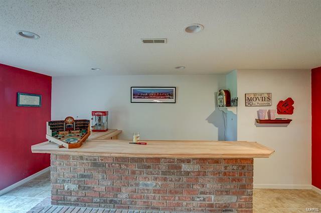 9514 State Route 143 Edwardsville, IL 62025 - Photo 20 of 29 a bedroom with a bed and dresser