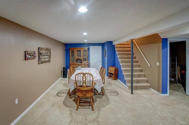 9514 State Route 143 Edwardsville, IL 62025 - Photo 21 of 29 a view of a livingroom with furniture and staircase