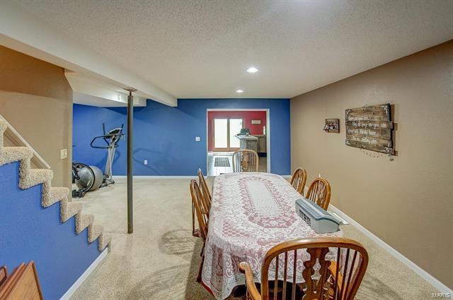 9514 State Route 143 Edwardsville, IL 62025 - Photo 22 of 29 a view of a dining room with furniture