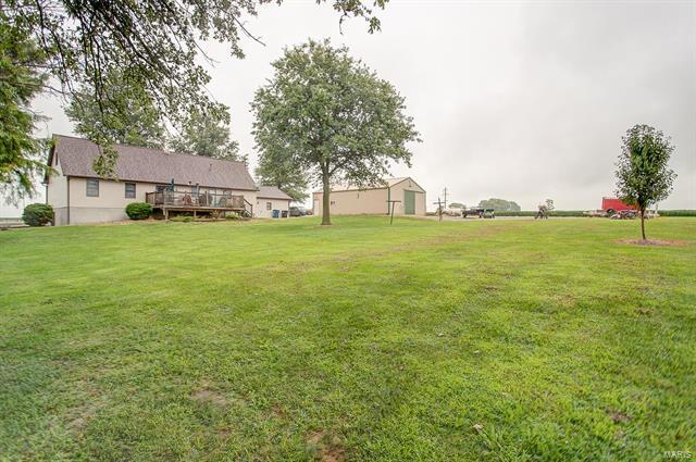 9514 State Route 143 Edwardsville, IL 62025 - Photo 23 of 29 a backyard of a house with lots of green space