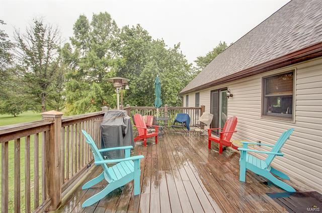 9514 State Route 143 Edwardsville, IL 62025 - Photo 27 of 29 a balcony with wooden floor and outdoor seating