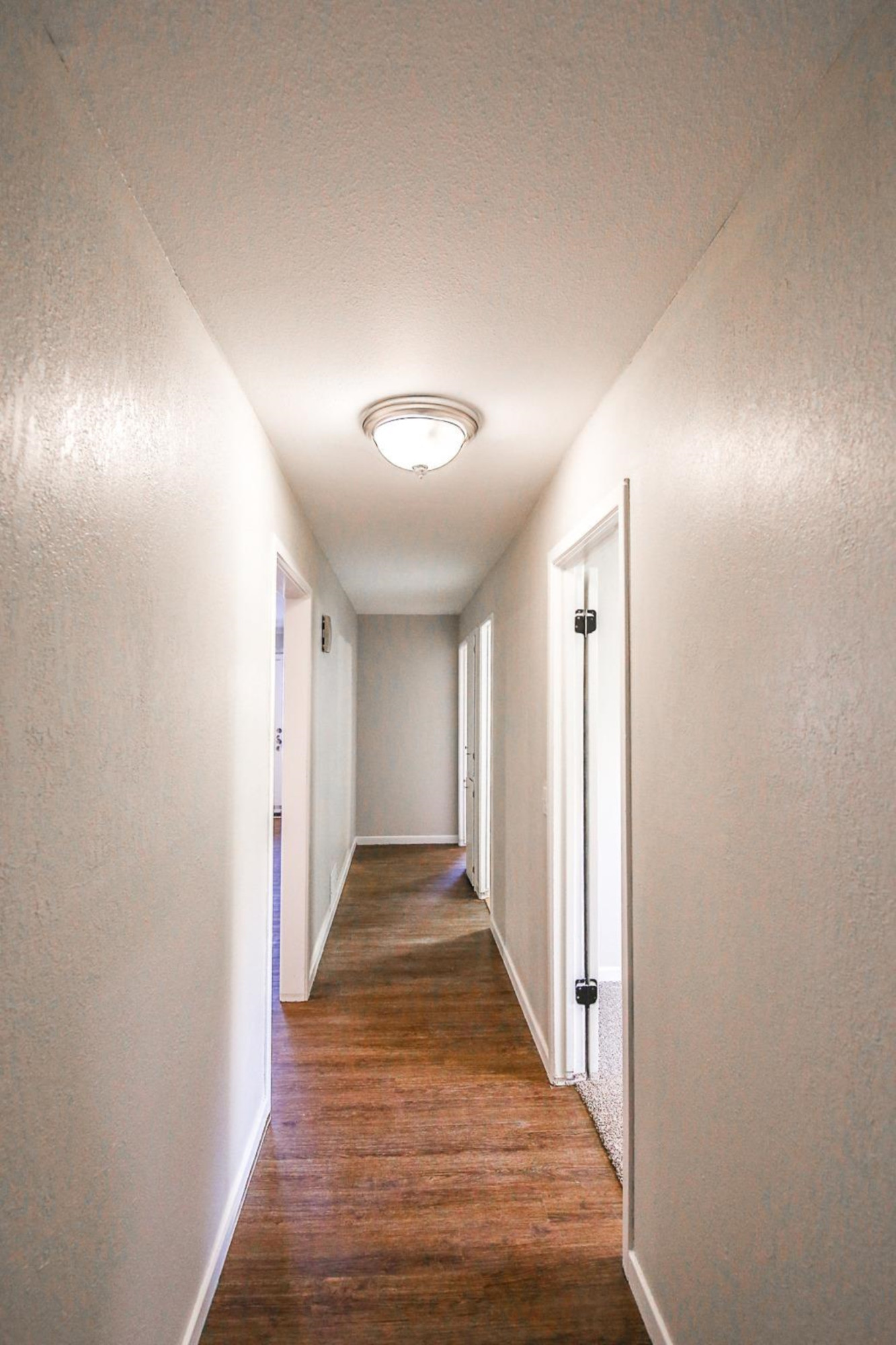 4403 49th Street Lubbock, TX 79414 - Photo 9 of 10 a view of hallway with wooden floor