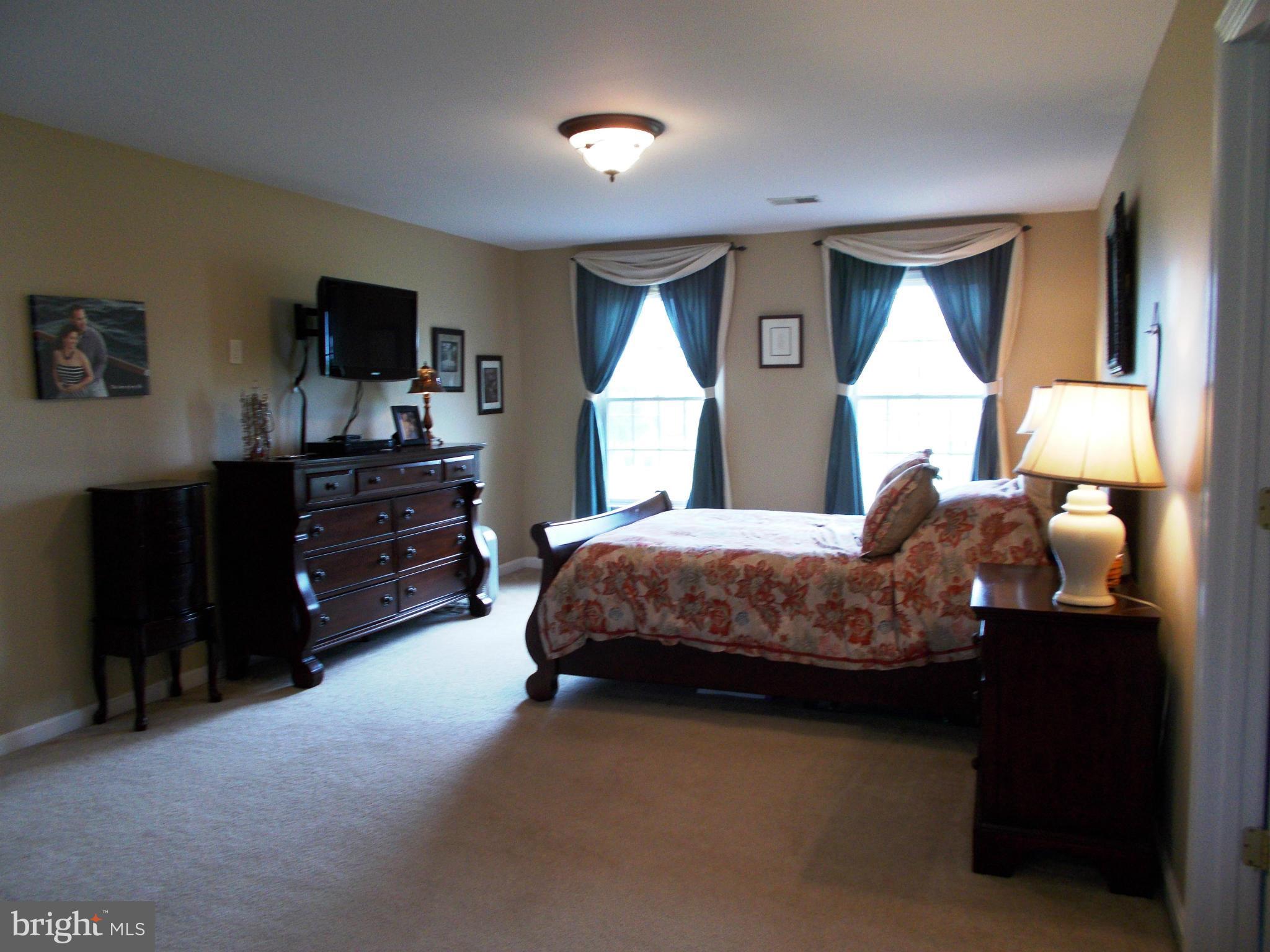 12658 Spickler Road Clear Spring, MD 21722 - Photo 14 of 21 a bedroom with a bed window and dresser