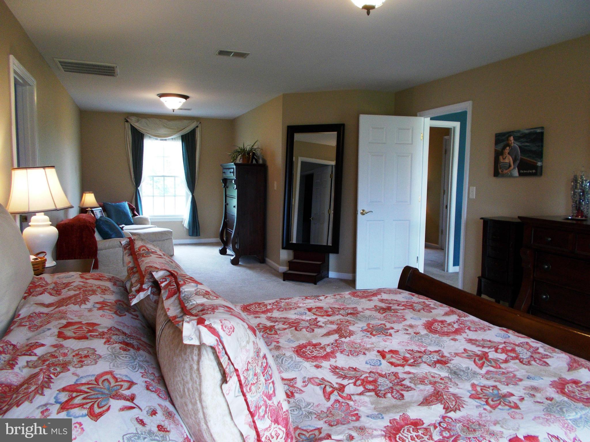 12658 Spickler Road Clear Spring, MD 21722 - Photo 15 of 21 a bedroom with a bed and a dresser