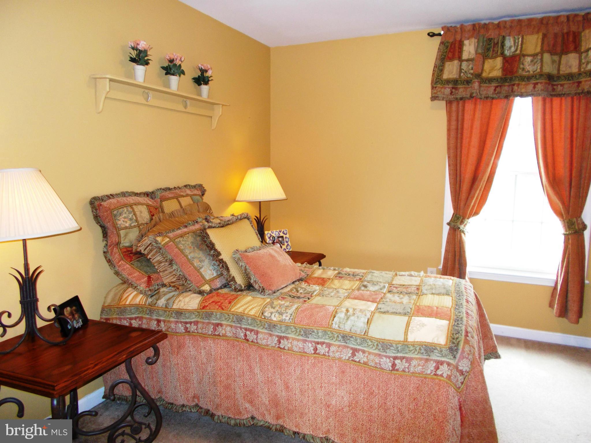 12658 Spickler Road Clear Spring, MD 21722 - Photo 18 of 21 a bedroom with a bed window and a lamp
