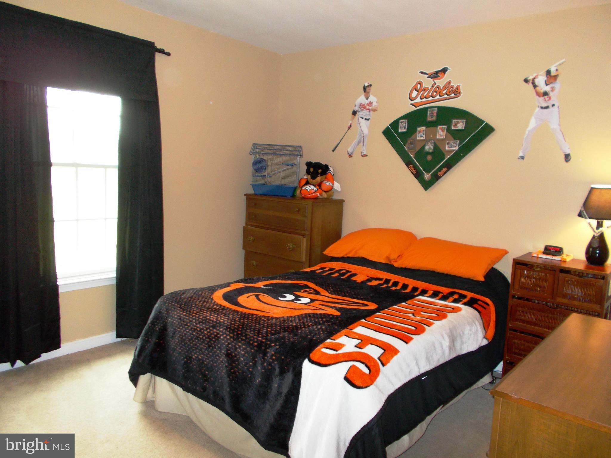 12658 Spickler Road Clear Spring, MD 21722 - Photo 21 of 21 a bedroom with a bed and painting on the wall
