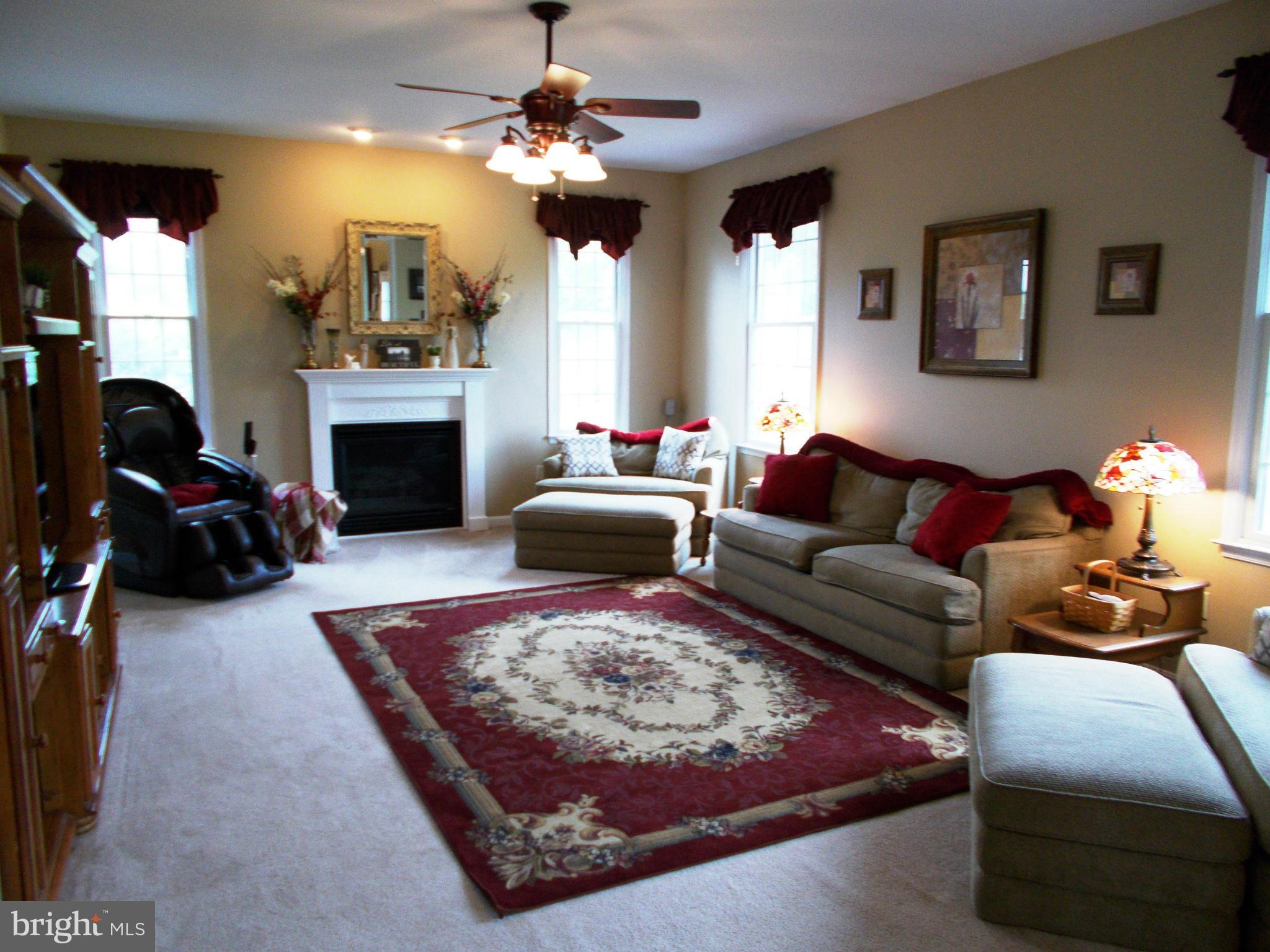 12658 Spickler Road Clear Spring, MD 21722 - Photo 9 of 21 a living room with furniture fireplace and window