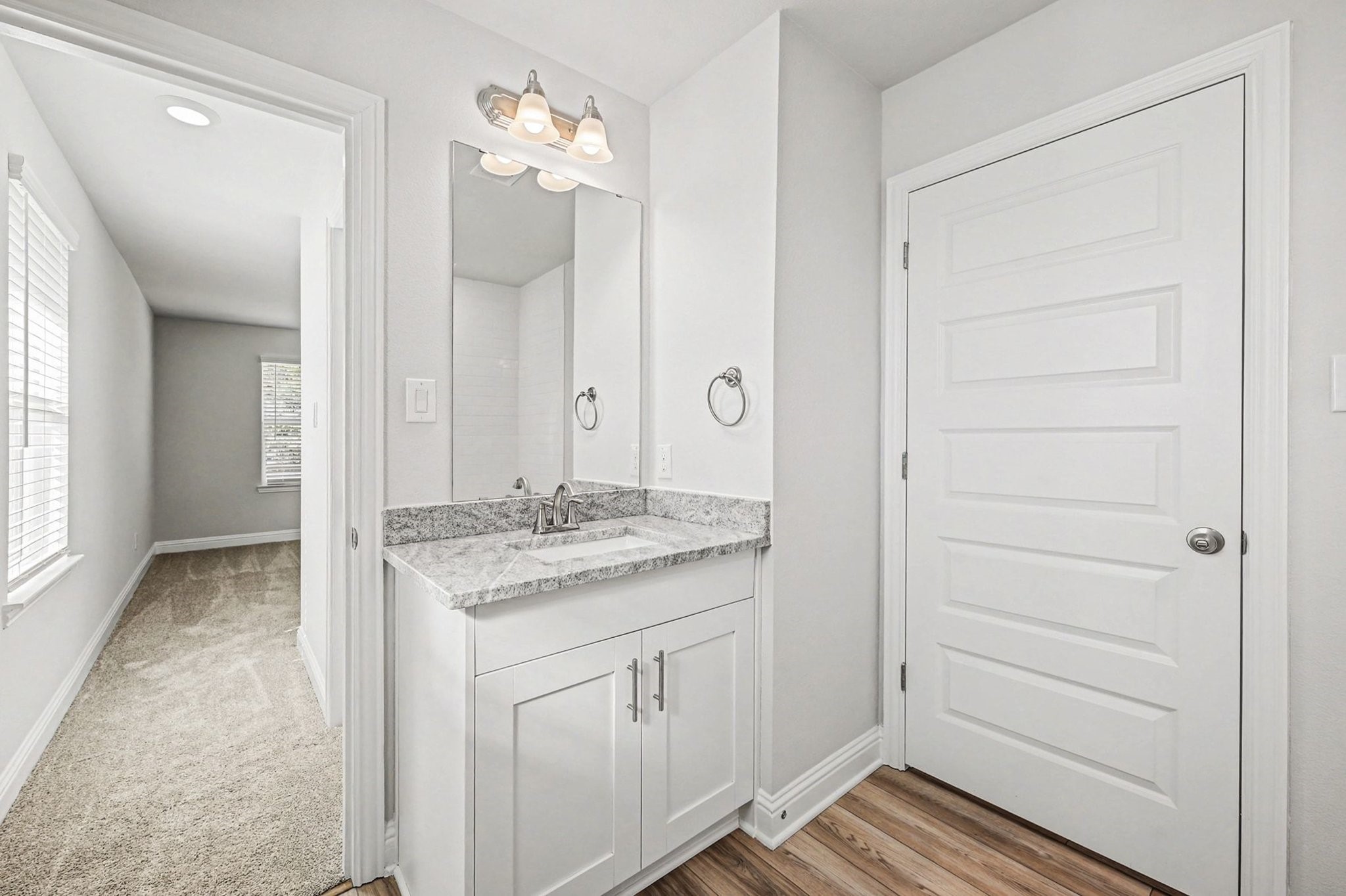601 Greystone Lane Angleton, TX 77515 - Photo 14 of 32 a bathroom with a granite countertop sink and a mirror