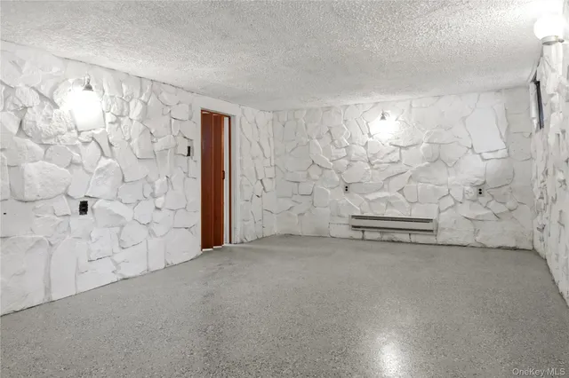 a bathroom with a granite countertop sink