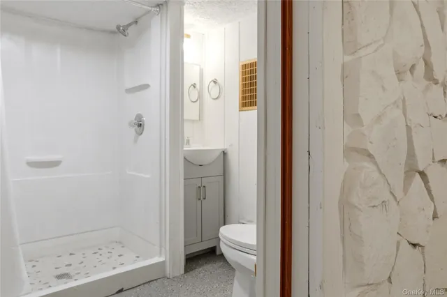 a bathroom with a granite countertop window