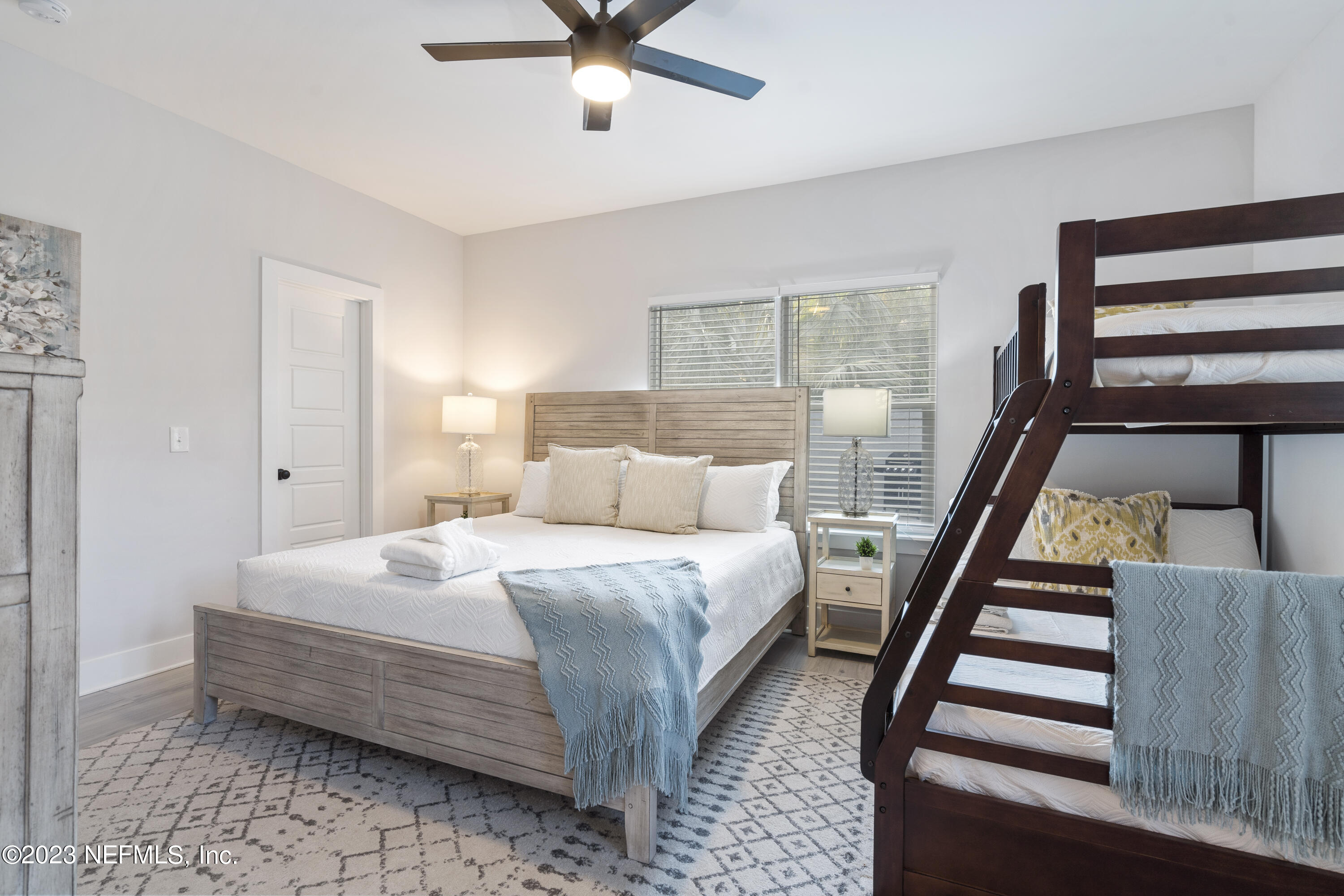 310 3rd Street St. Augustine, FL 32084 - Photo 17 of 46 a bedroom with a bed and a window