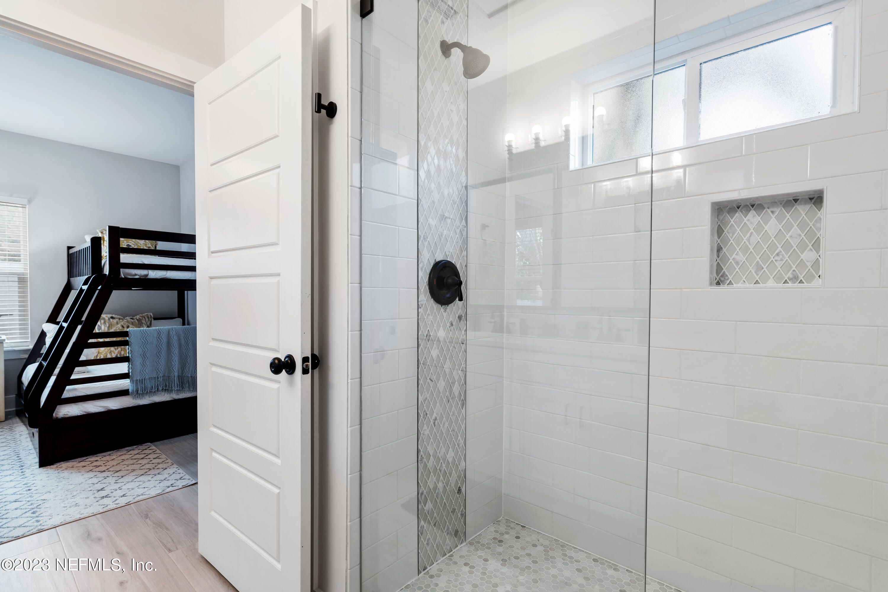 310 3rd Street St. Augustine, FL 32084 - Photo 21 of 46 a bathroom with a shower