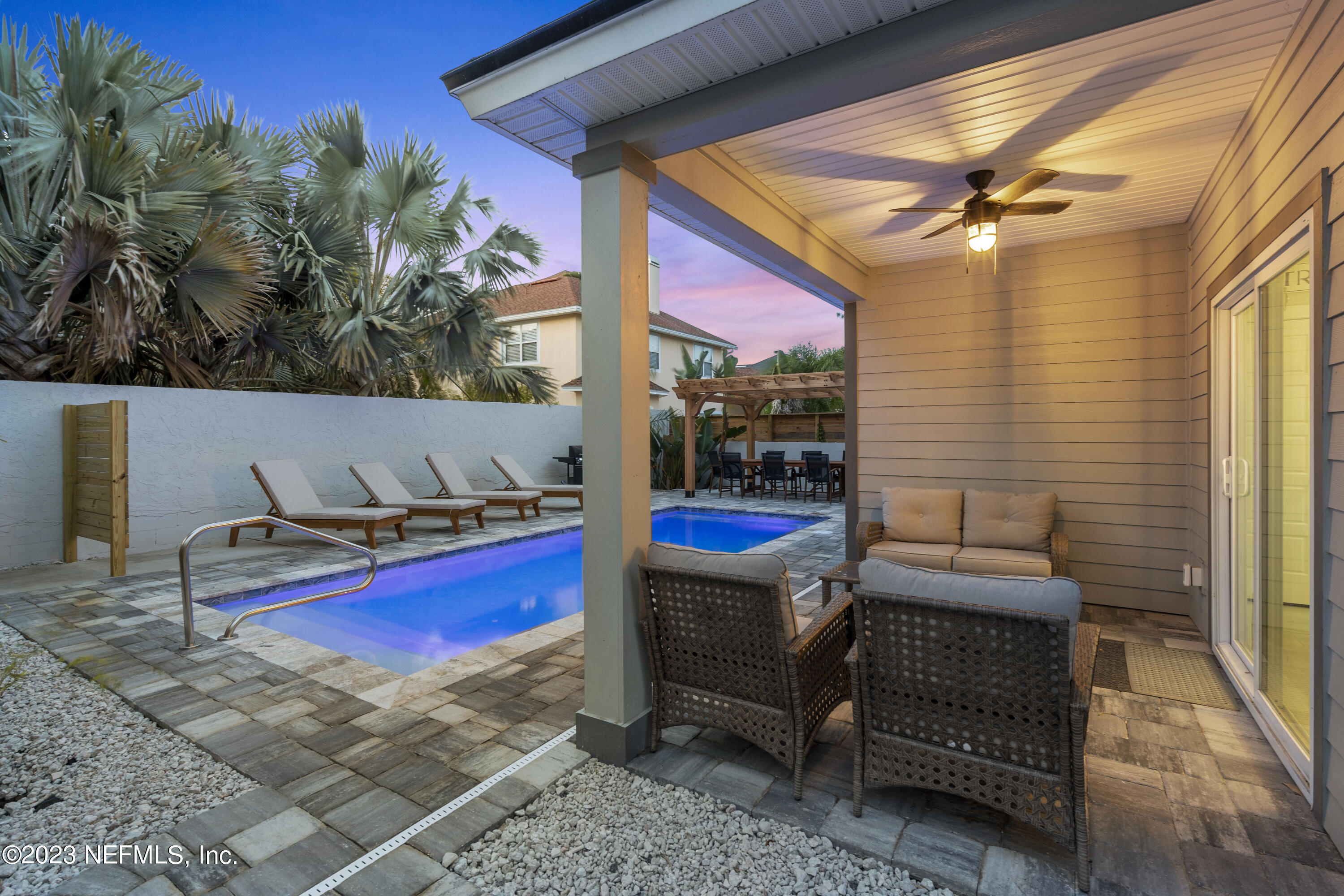 310 3rd Street St. Augustine, FL 32084 - Photo 33 of 46 a backyard with a table and chairs