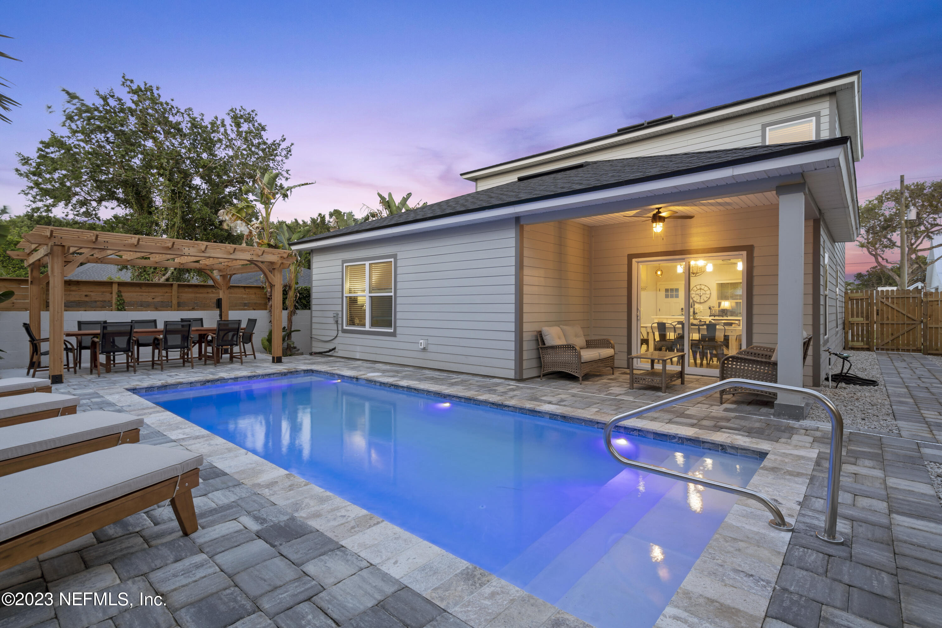 310 3rd Street St. Augustine, FL 32084 - Photo 35 of 46 a view of a swimming pool with chairs