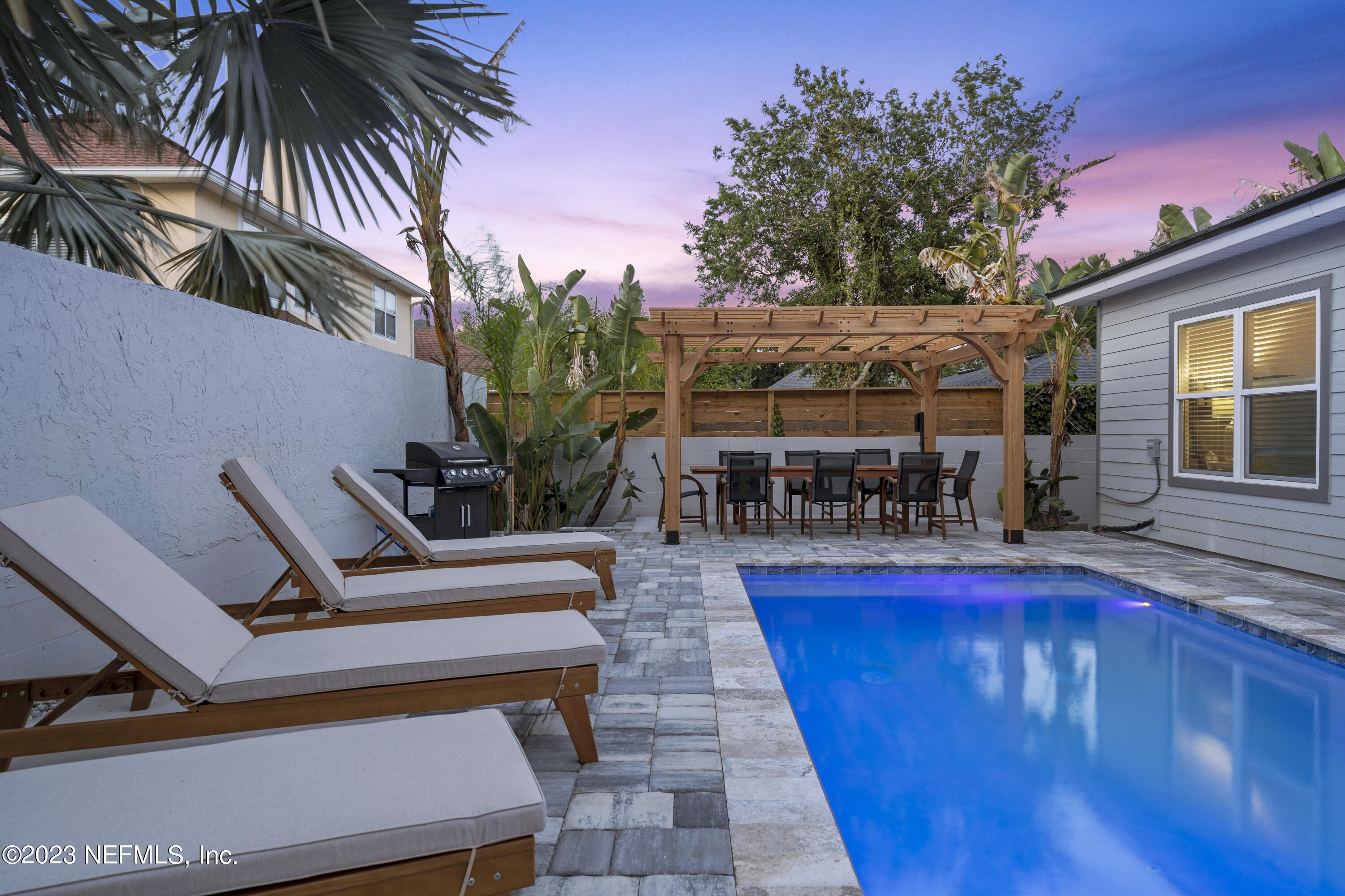 310 3rd Street St. Augustine, FL 32084 - Photo 36 of 46 a view of a chairs and table in the patio