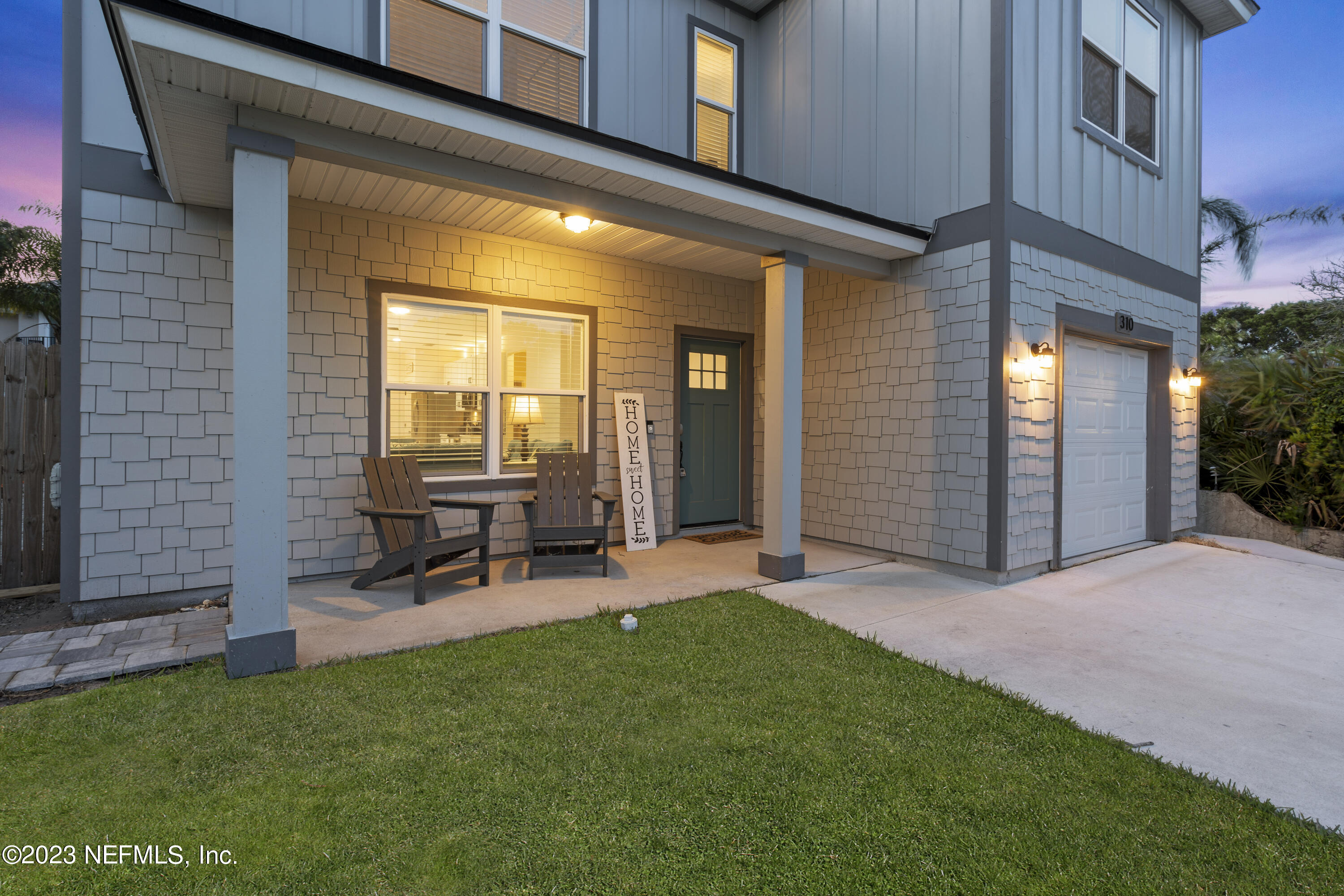310 3rd Street St. Augustine, FL 32084 - Photo 7 of 46 a view of a chair and table in backyard of the house