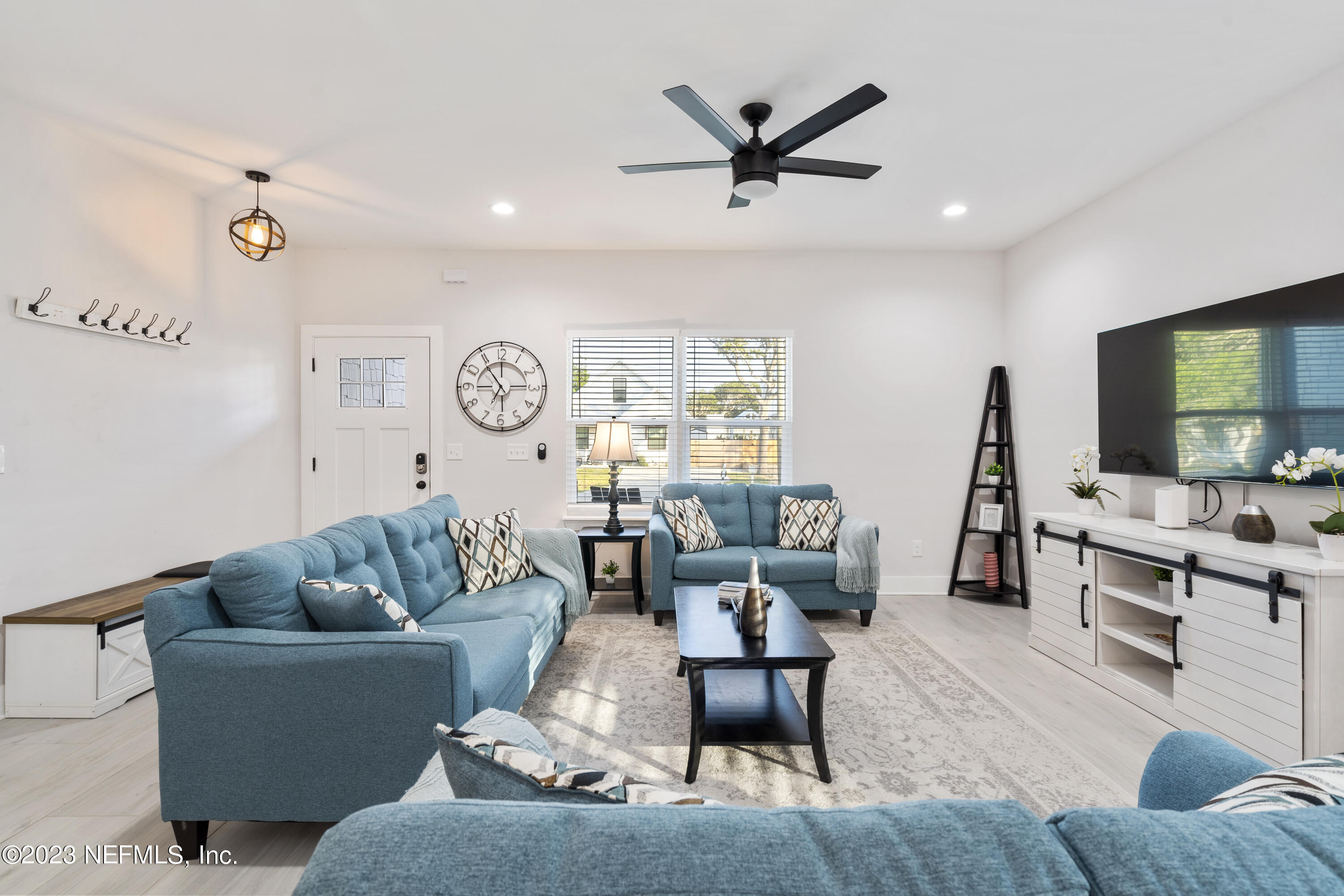 310 3rd Street St. Augustine, FL 32084 - Photo 9 of 46 a living room with furniture and a flat screen tv