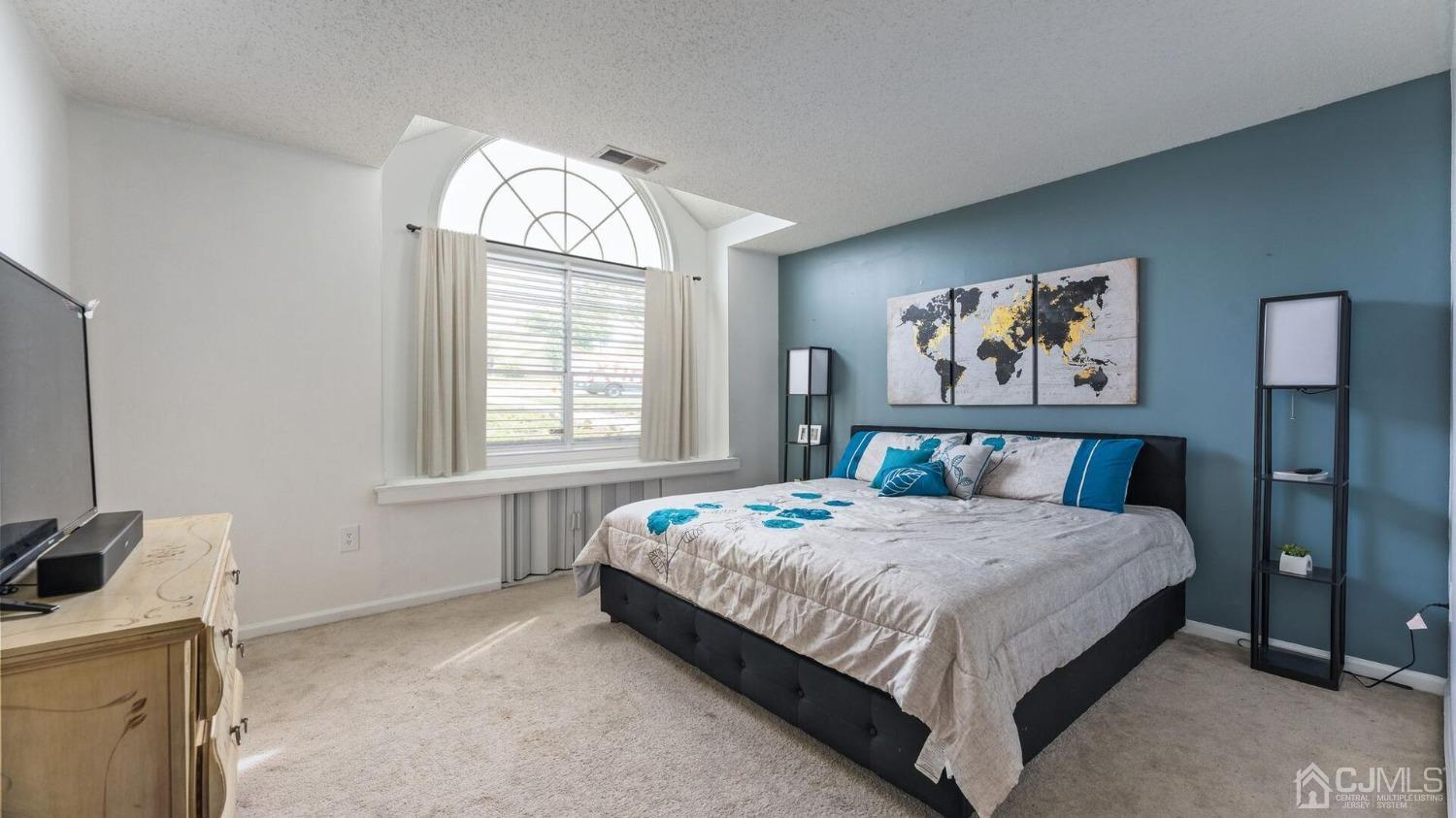 835 Edpas Road New Brunswick, NJ 08901 - Photo 7 of 15 a bedroom with a bed and a window