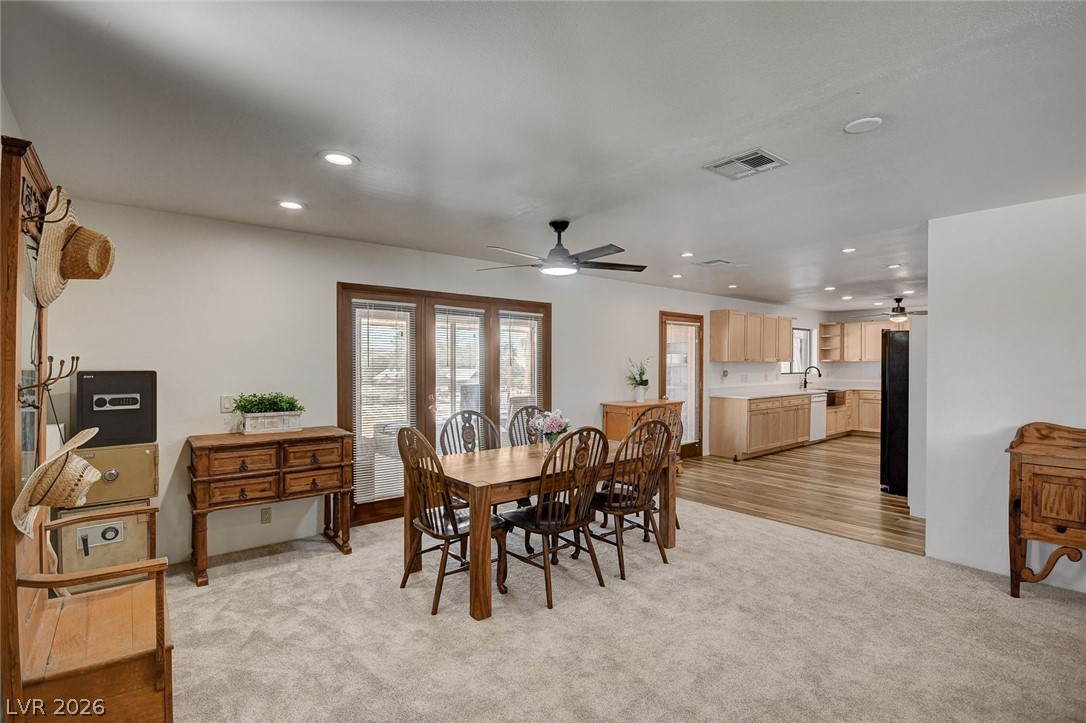 1920 Bowman Road Logandale, NV 89021 - Photo 19 of 68 An open layout connects the dining space to the kitchen over classic wood frames.