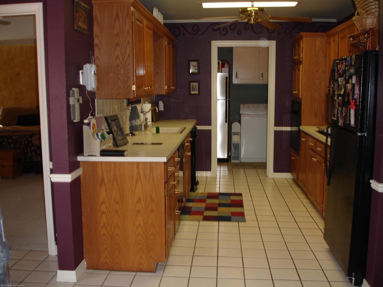 6315 Elmhurst Road Amarillo, TX 79106 - Photo 8 of 9 a hallway view with the view of living room