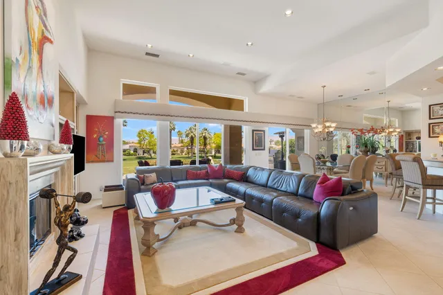 a kitchen with stainless steel appliances kitchen island granite countertop a refrigerator and cabinets