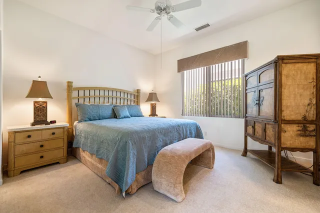 a bathroom with a double vanity sink mirror and shower