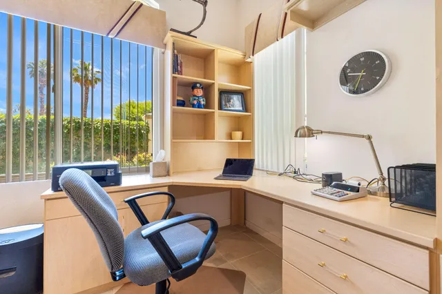 an aerial view of a house with a garden